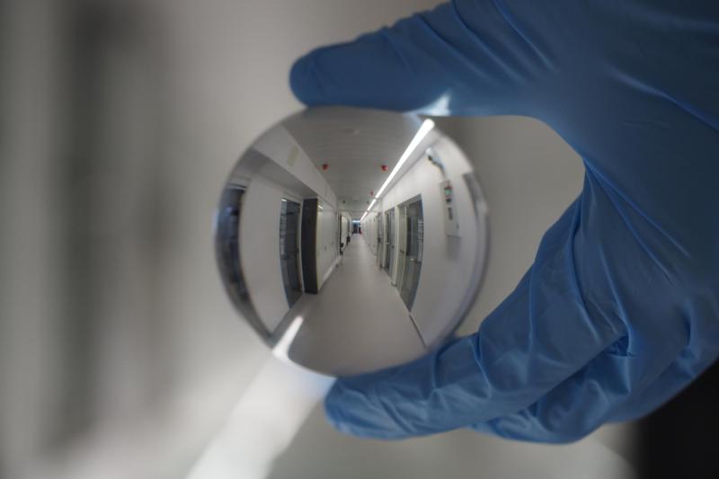 Laboratory corridor magnified through lens ball