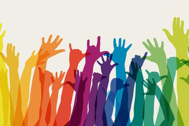 Rainbow colored silhouettes of raised arms against white background