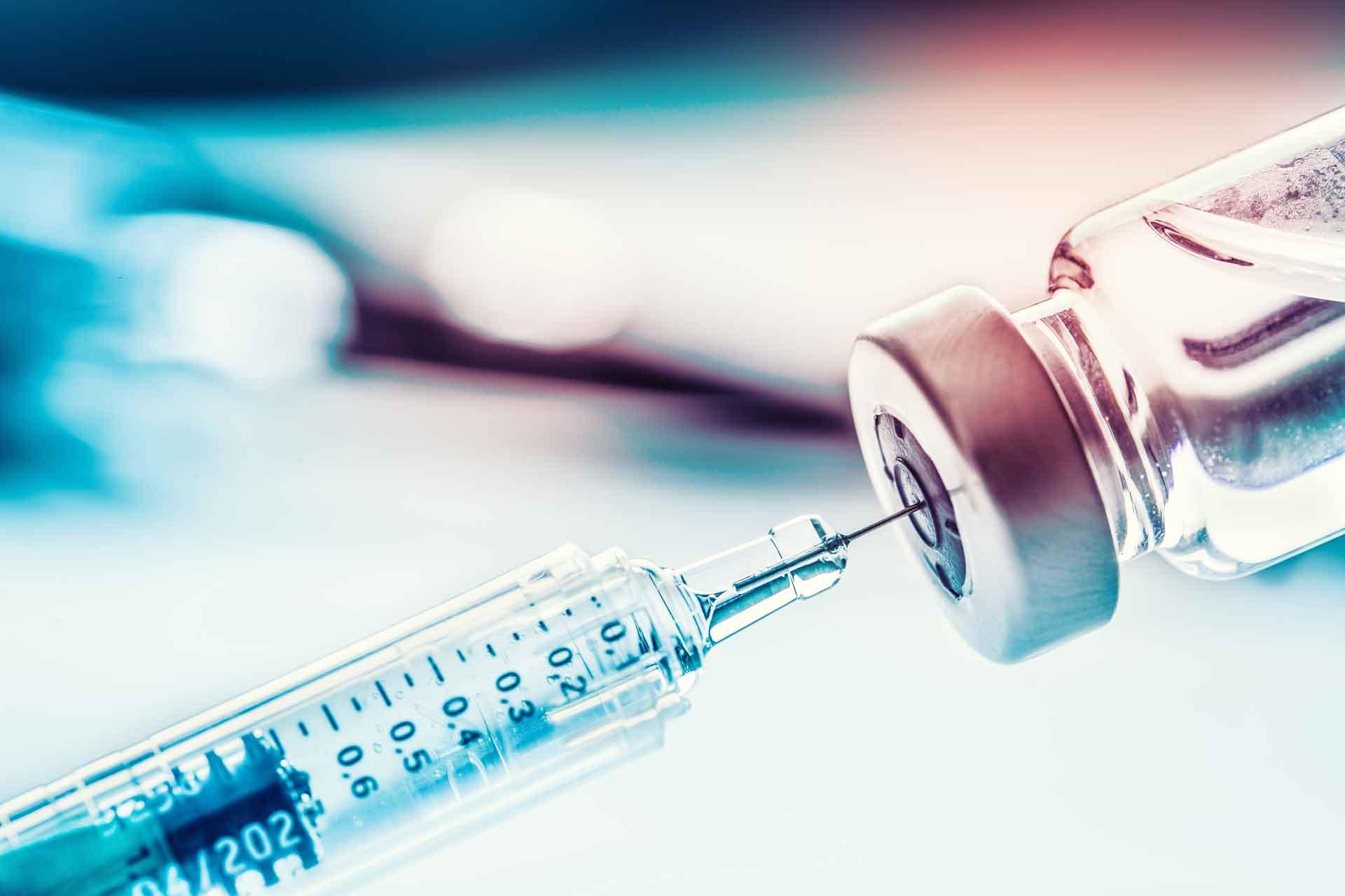 Vaccine being drawn from a vile Vaccine being drawn from a vile